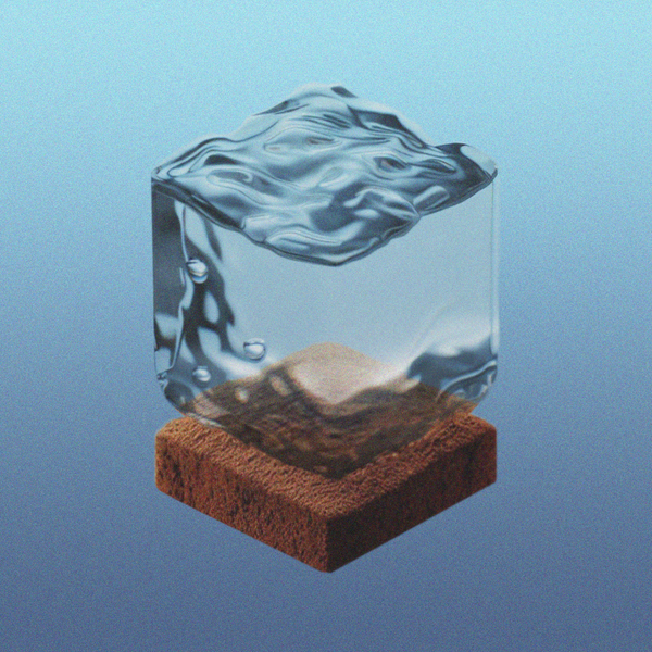 a cube of liquid water floating above a cuboid of coffee grounds